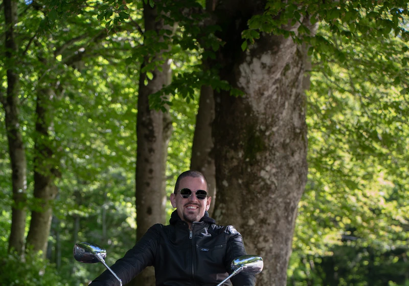 Stefano on His Motorcycle in the Woods